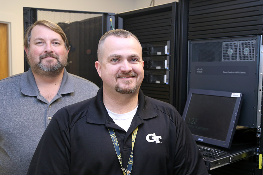 Veterans John Temple and Mike Anderson in one of the School of Civil and Environmental Engineering server rooms. The pair now provide information technology support to the School's students, faculty and staff. (Photo: Joshua Stewart)