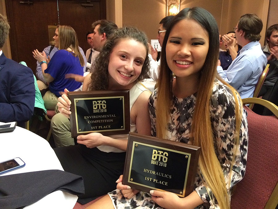 Mia Pendergast and Caroline Efferth with their first-place awards in the environmental and hydraulics competitions at the Carolinas Conference banquet. (Photo: Danny Maciolek)
