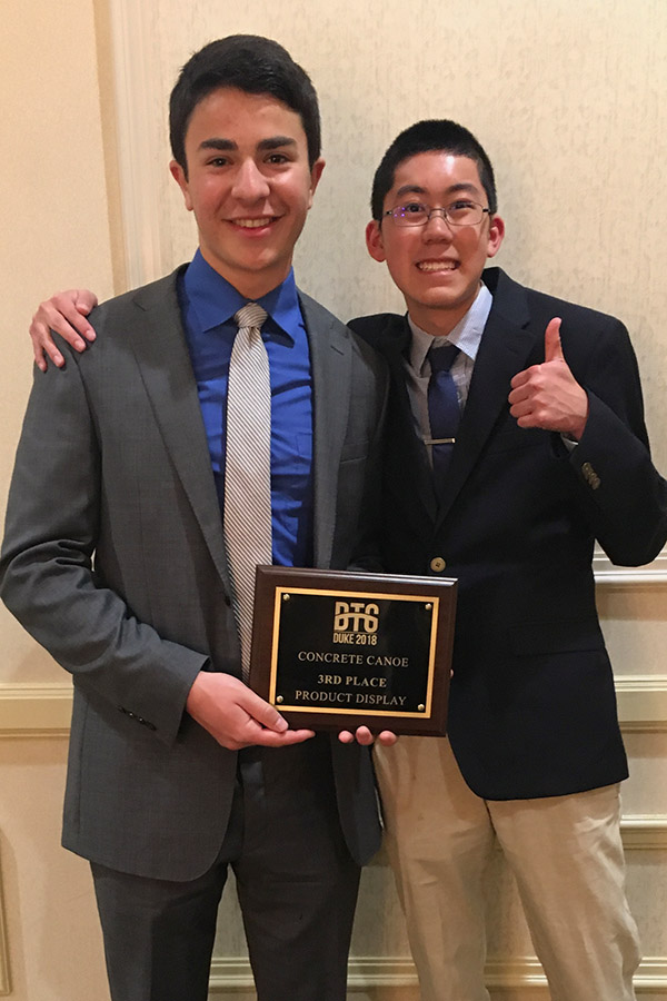 Concrete canoe team members Ben Weishaar and Conner Szeto with the award for their display presentation. (Photo: 