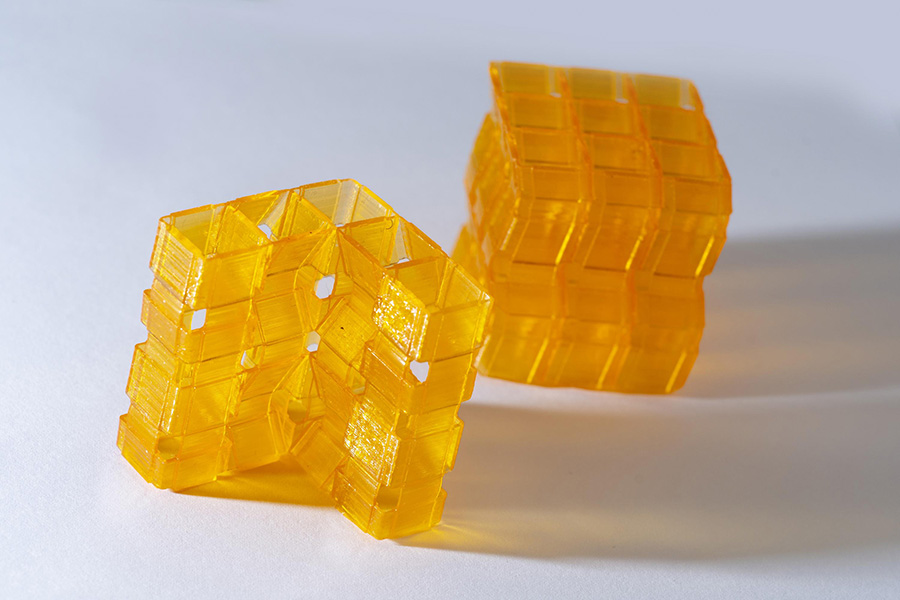 Closeup of two origami structures created through Digital Light Processing 3D printing. (Photo: Christopher Moore)