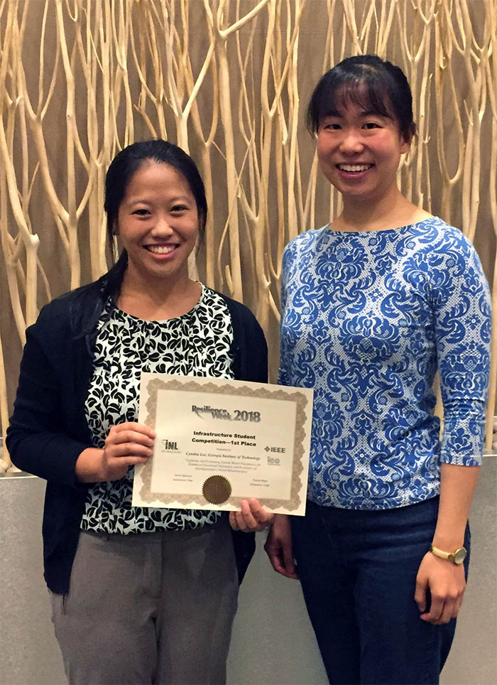 Graduate student Cynthia Lee, left, and Assistant Professor Iris Tien with their first-place infrastructure paper aware at Resilience Week 2018. (Photo Courtesy: Iris Tien)