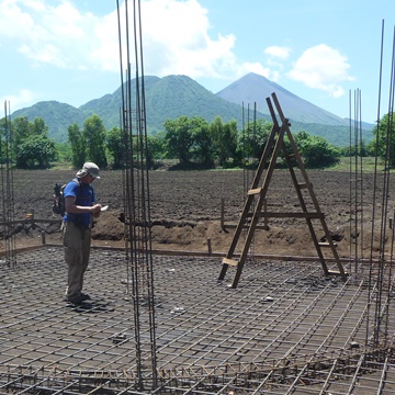 Andrew Loo surveying land for a water system in Nicaragua