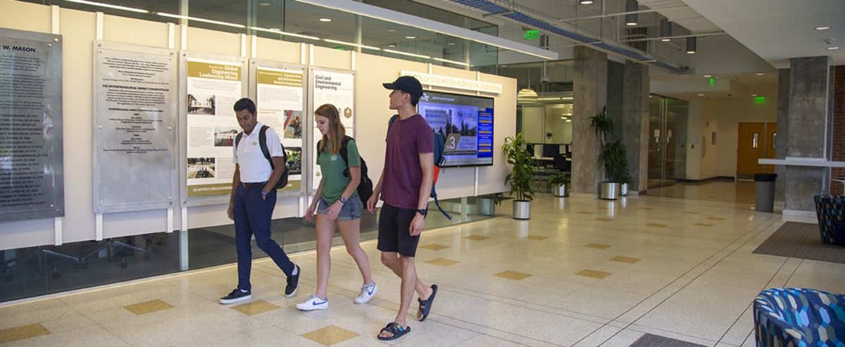 Students walking in the mason building lobby