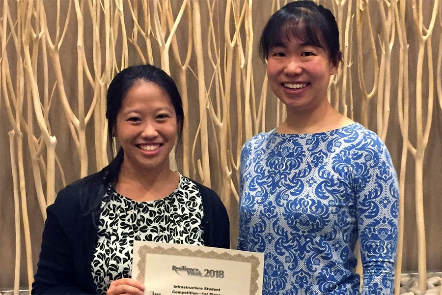 Graduate student Cynthia Lee, left, and Assistant Professor Iris Tien with their first-place infrastructure paper aware at Resilience Week 2018. (Photo Courtesy: Iris Tien)